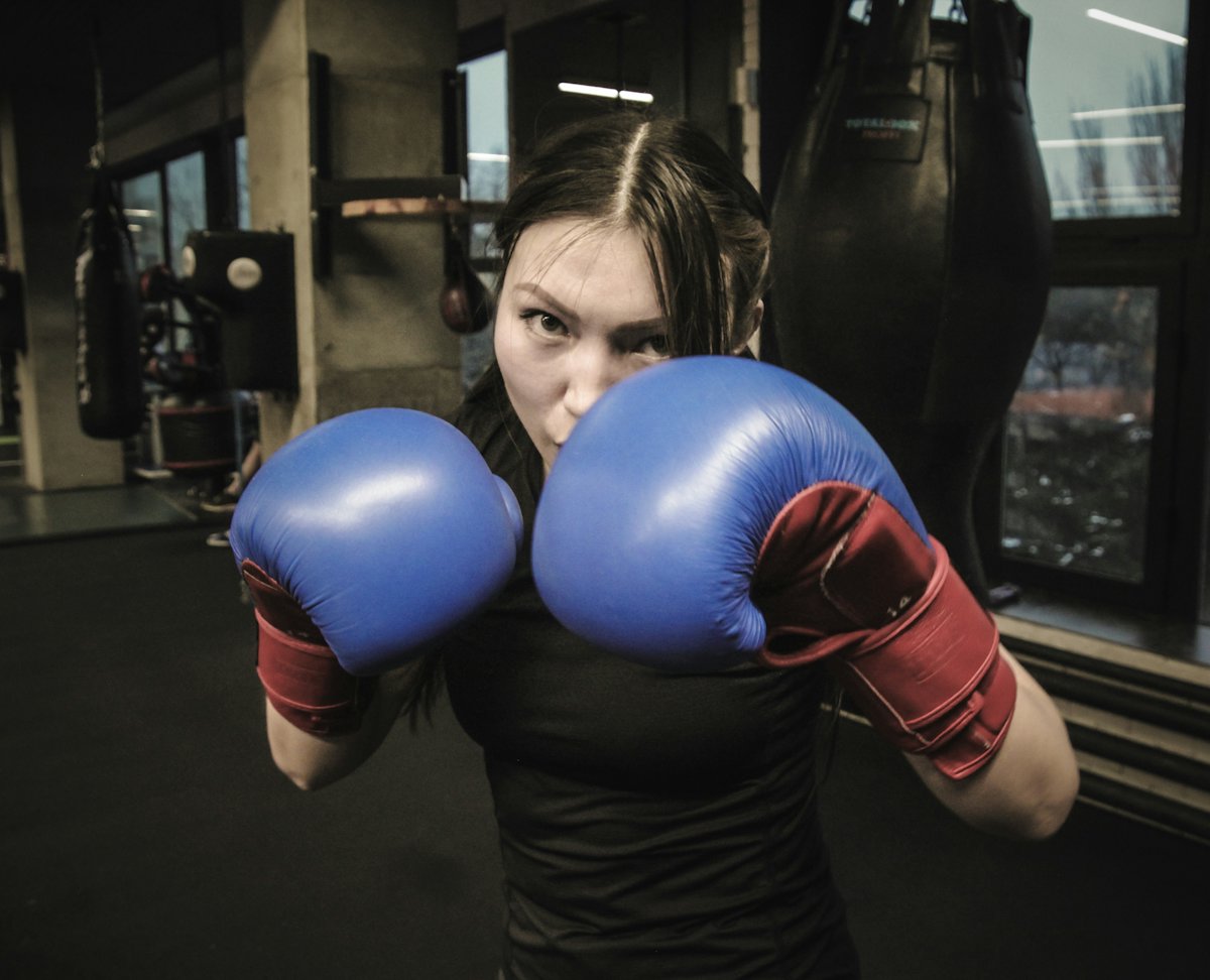 A member training with boxing gloves