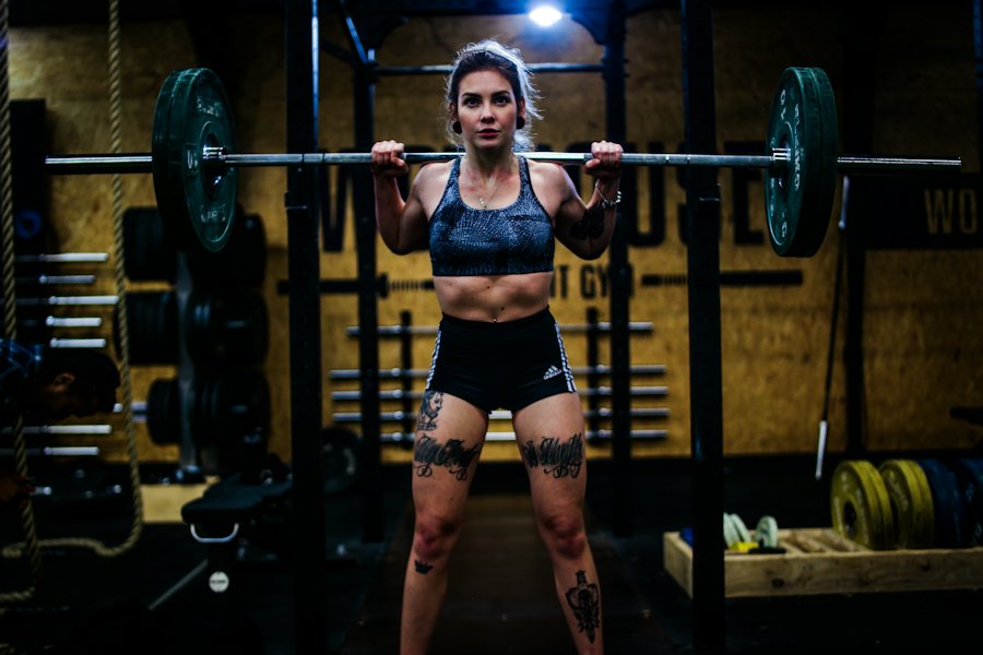 Coach Sam lifting a barbell
