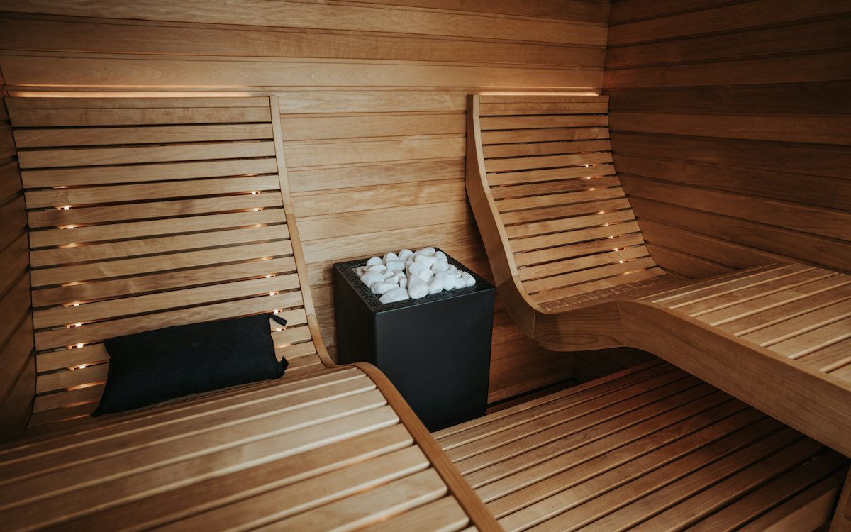 A cedar sauna with warm lighting